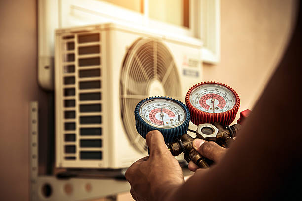 Professional Air Conditioning Service technician working in Palm City, FL